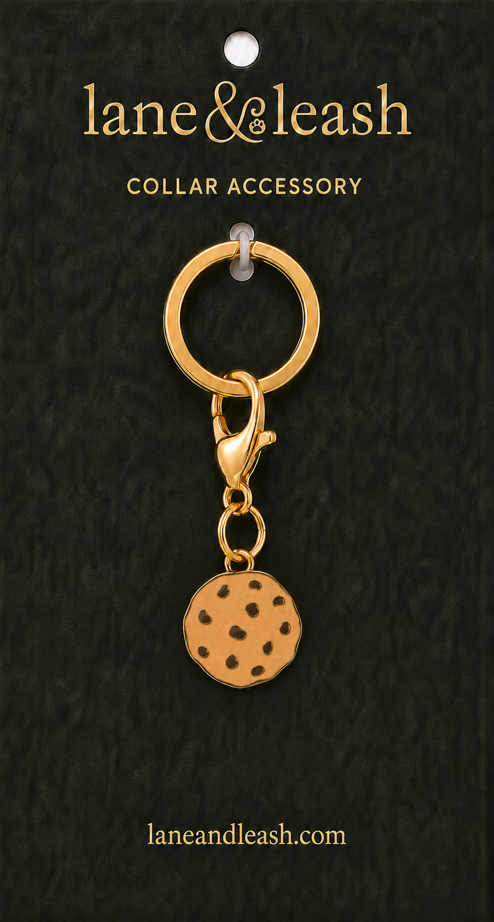 Chocolate chip cookie Lane & Leash collar accessory charm displayed on dark green packaging card with lobster claw clasp and jump ring