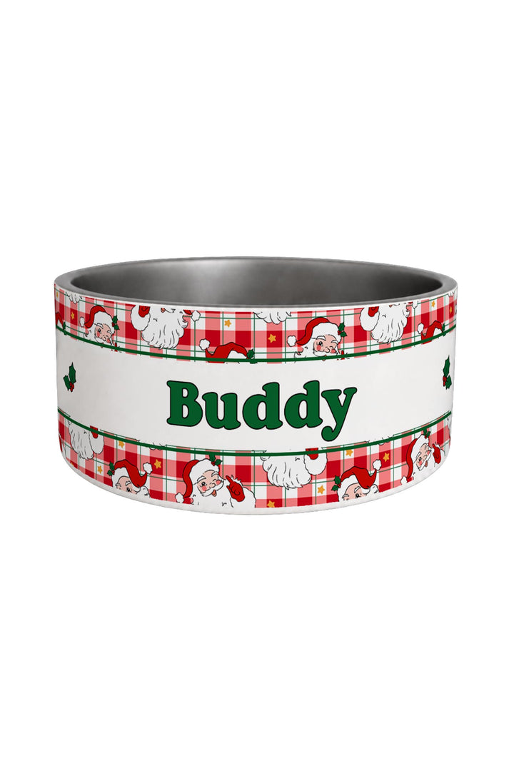 A custom Lane & Leash pet bowl with a stainless steel interior and a festive white, red, and green holiday-themed band around the outside. The band features a red and white gingham pattern with Santa Claus illustrations and the name 'Buddy' printed in green in the center.