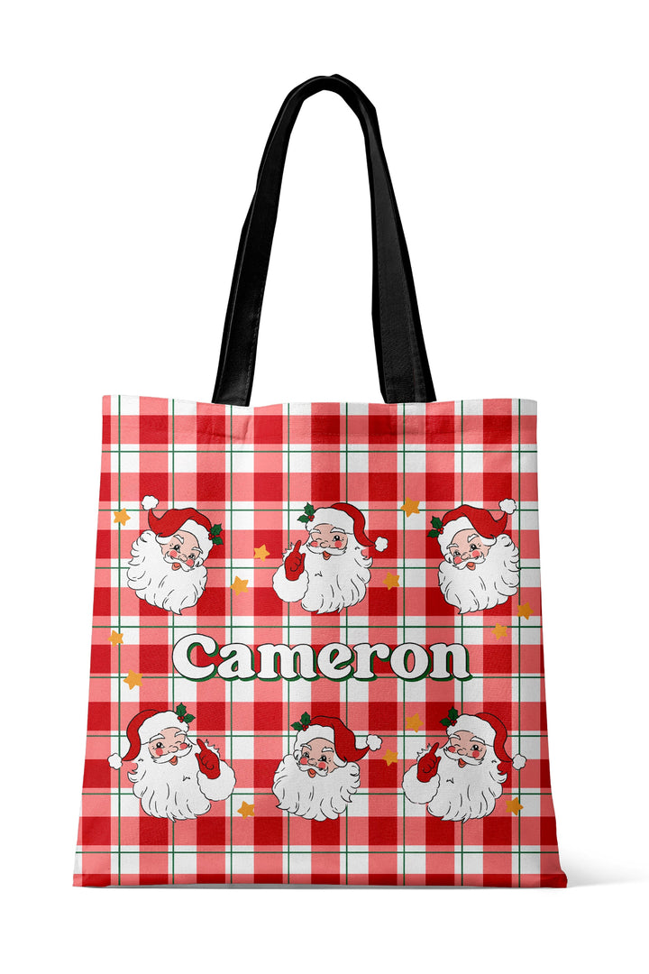 Caden Lane personalized Christmas tote bag featuring a custom name on a classic red and green plaid design, perfect for holiday shopping, Christmas gifts, travel, and matching family pajamas.