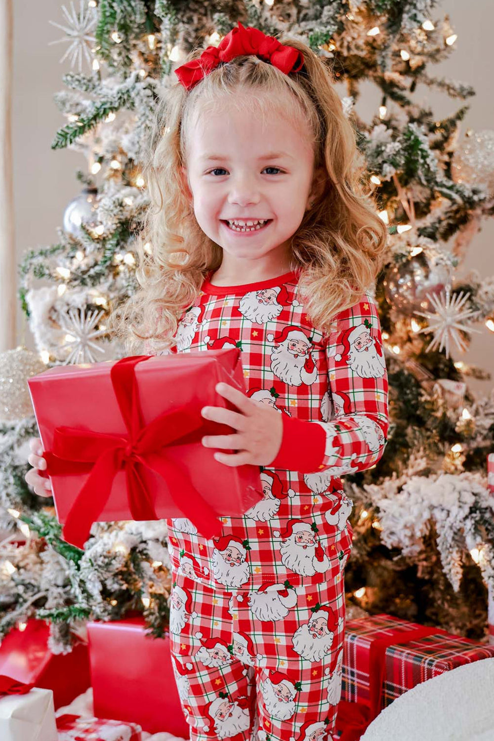 Caden Lane Cozy Claus kids' Christmas bamboo two-piece pajama set in a vintage Santa plaid print, perfect for matching family pajamas and Christmas morning gift opening.