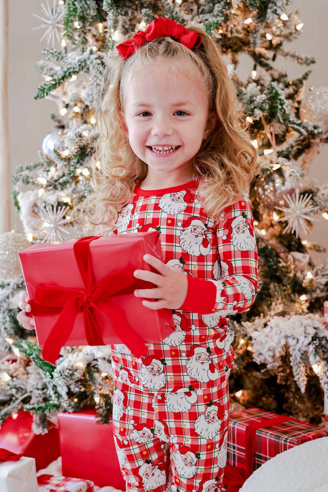 Caden Lane Cozy Claus kids' Christmas bamboo two-piece pajama set in a vintage Santa plaid print, perfect for matching family pajamas and Christmas morning gift opening.