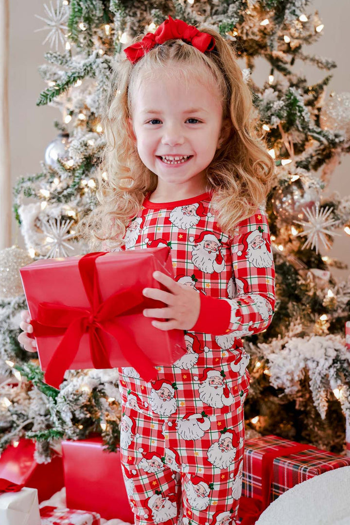 Caden Lane Cozy Claus kids' Christmas bamboo two-piece pajama set in a vintage Santa plaid print, perfect for matching family pajamas and Christmas morning gift opening.