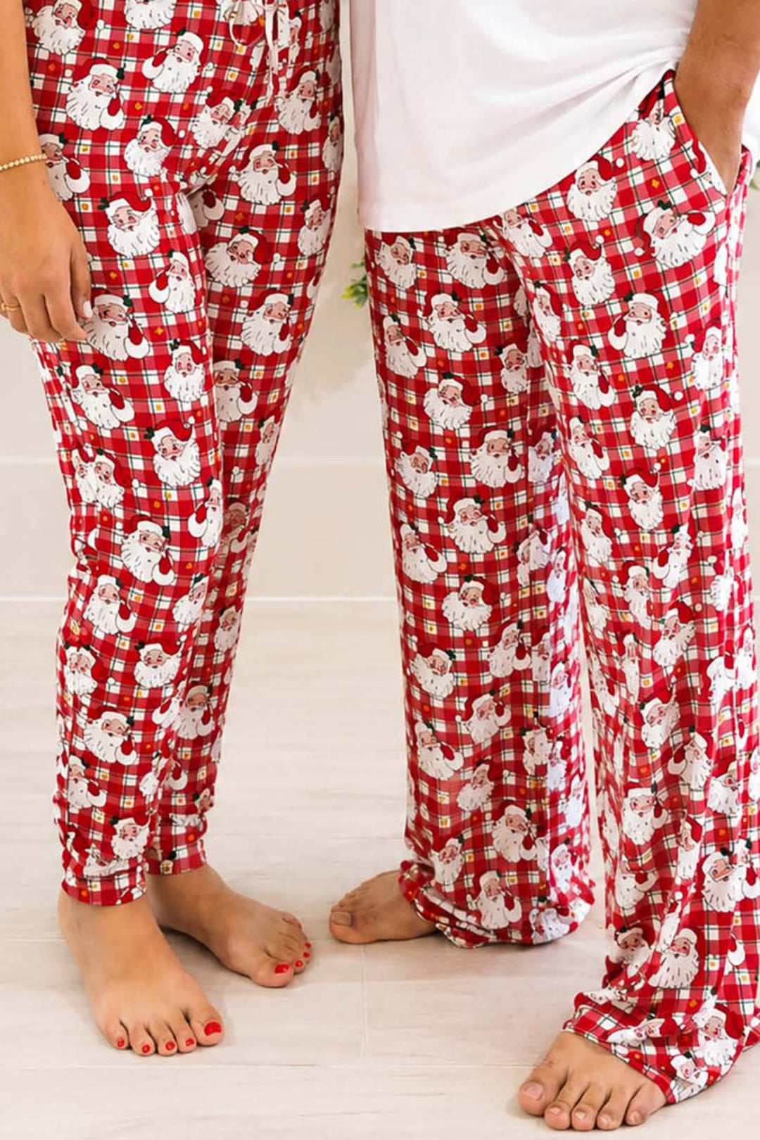 Close-up of Caden Lane Cozy Claus adult Christmas pajama pants in a vintage Santa plaid print, available in jogger and lounge styles for matching family holiday pajamas.