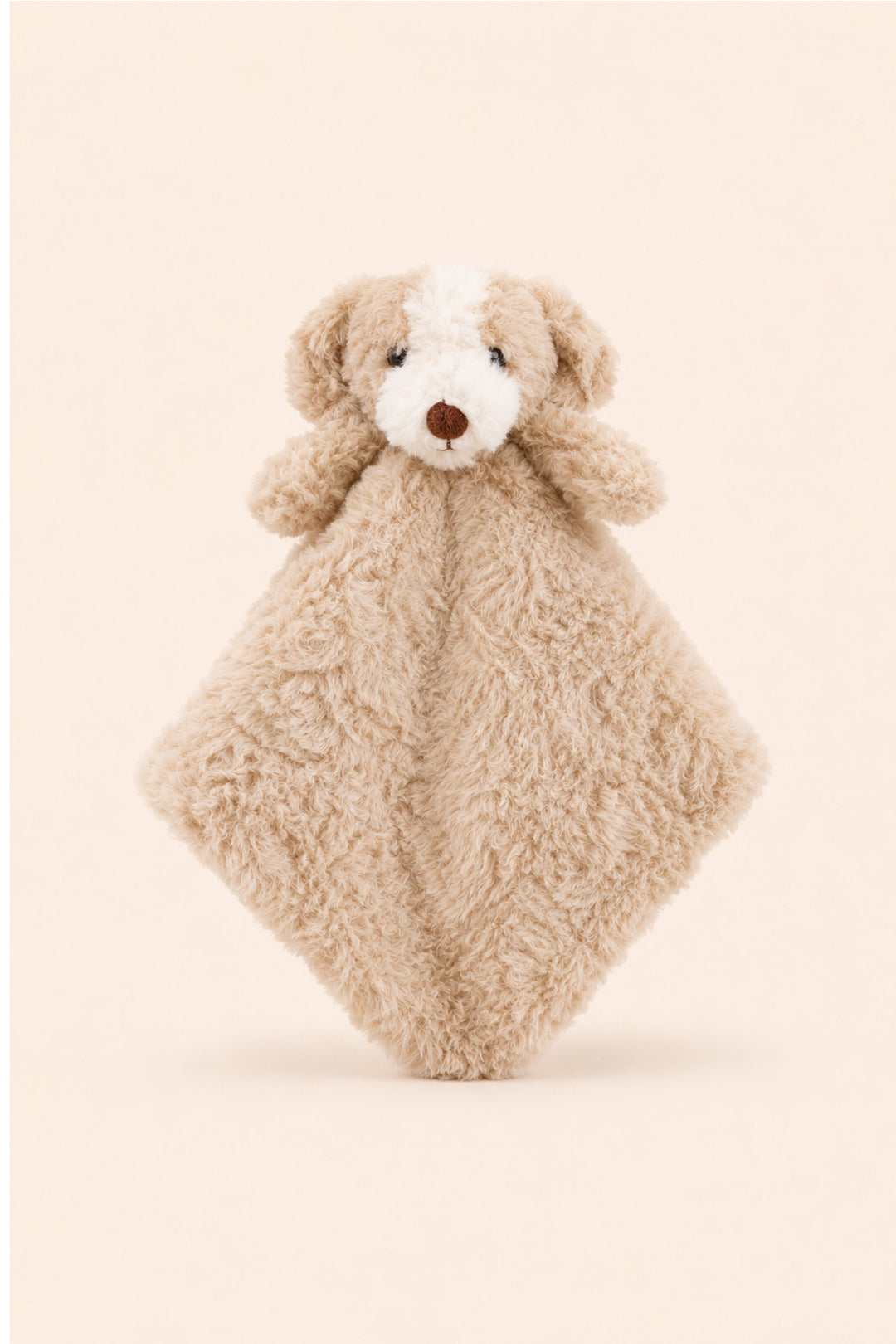 A Caden Lane plush puppy security blanket featuring a soft beige curly fur body, a white face patch, and a brown nose, set against a solid pale beige background.