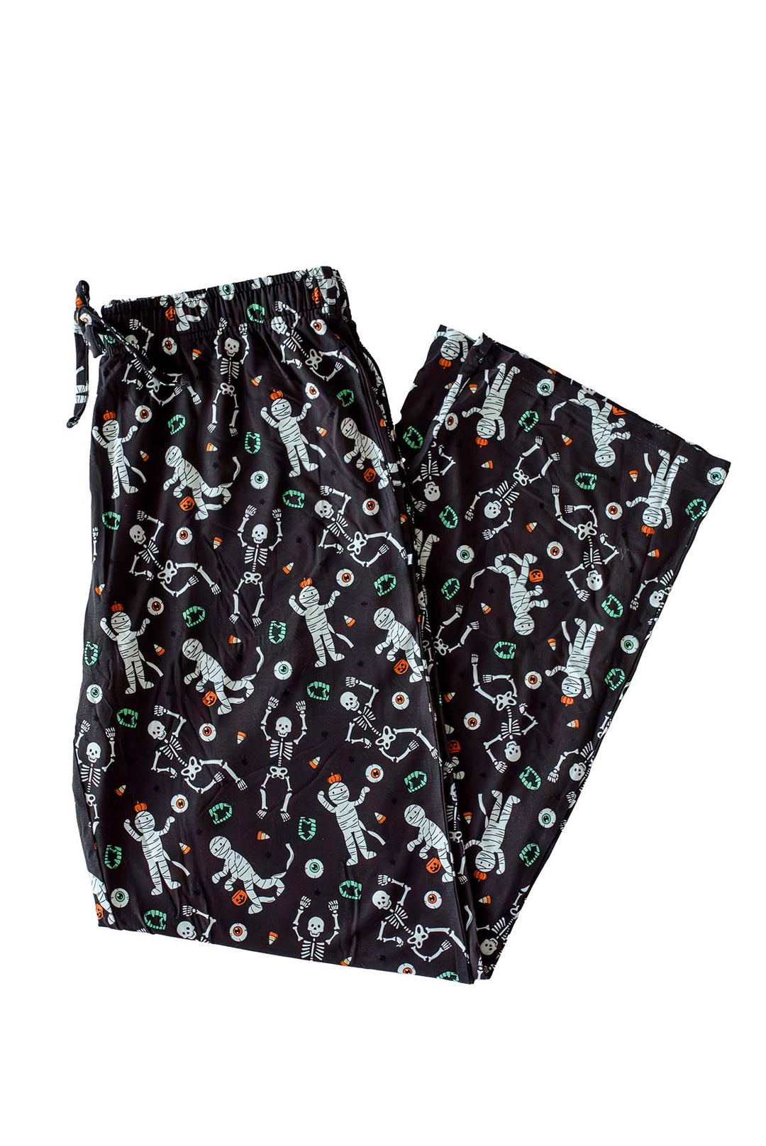 Black pajama pants with an all-over glow-in-the-dark skeleton and mummy print with candy corn accents, featuring a drawstring waistband.
