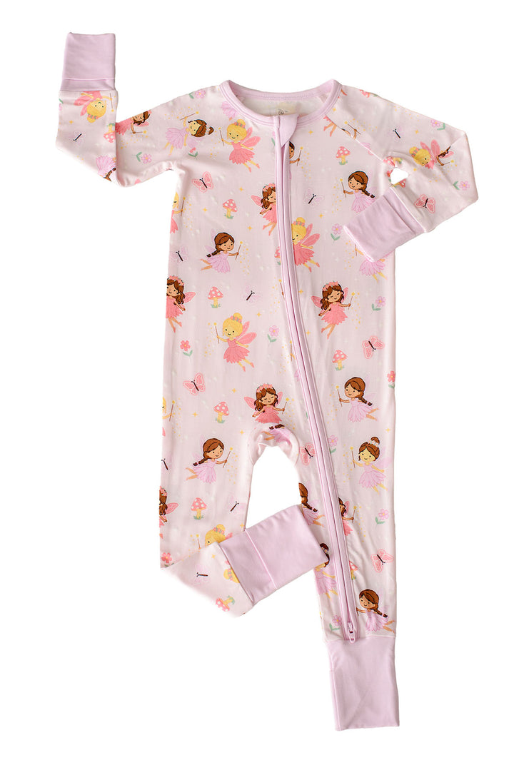 Flat lay of the Fairy Wishes glow-in-the-dark convertible bamboo zip romper with one sleeve and leg cuff folded over, light pink fairy print