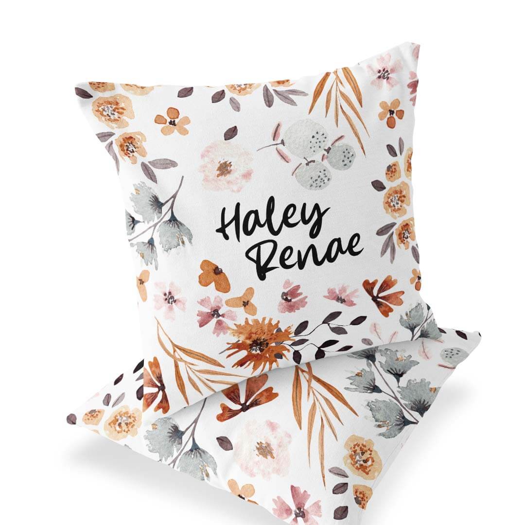 blue and orange floral accent pillow for nursery
