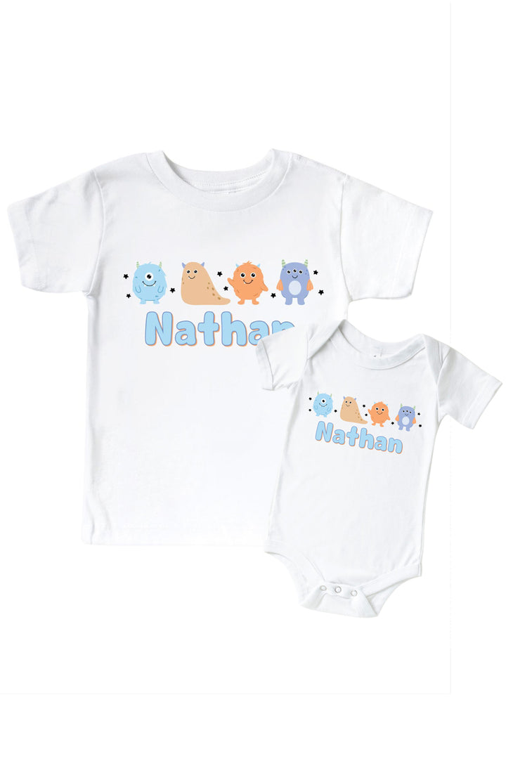 Caden Lane matching white "Nathan" t-shirt and onesie set with a row of blue, tan, orange, and purple cartoon monsters and stars