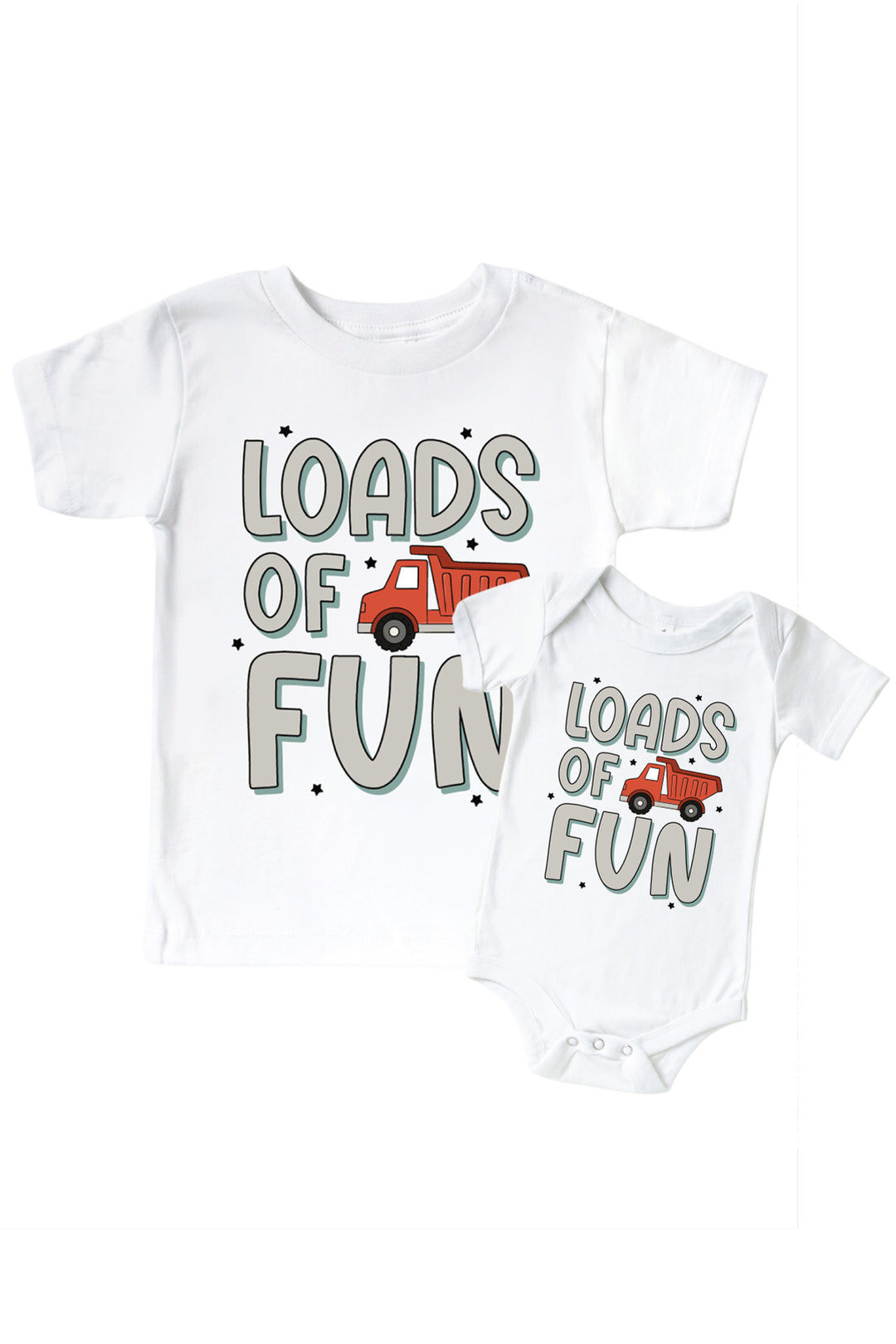 Flat lay of a Caden Lane white tee in a Busy Builder print featuring a red dump truck and black stars, reading "Loads of fun," paired with a matching bodysuit.