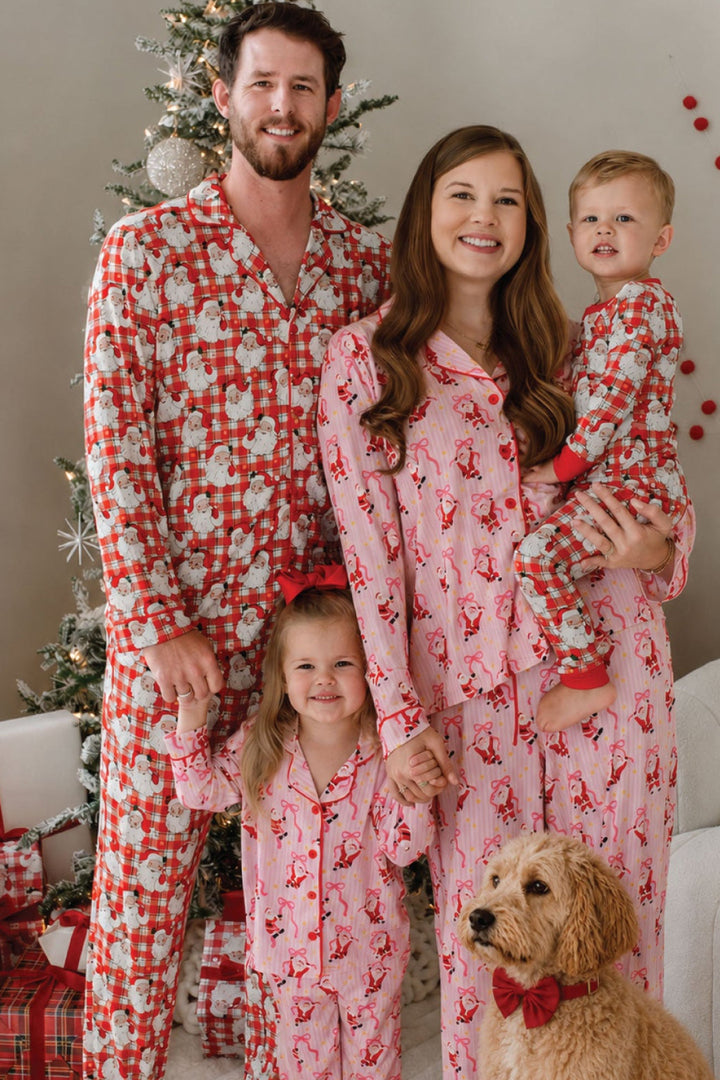 Family in Caden Lane matching Christmas pajamas featuring Cozy Claus vintage Santa plaid and coordinating holiday prints, with matching pet accessory for festive family photos.