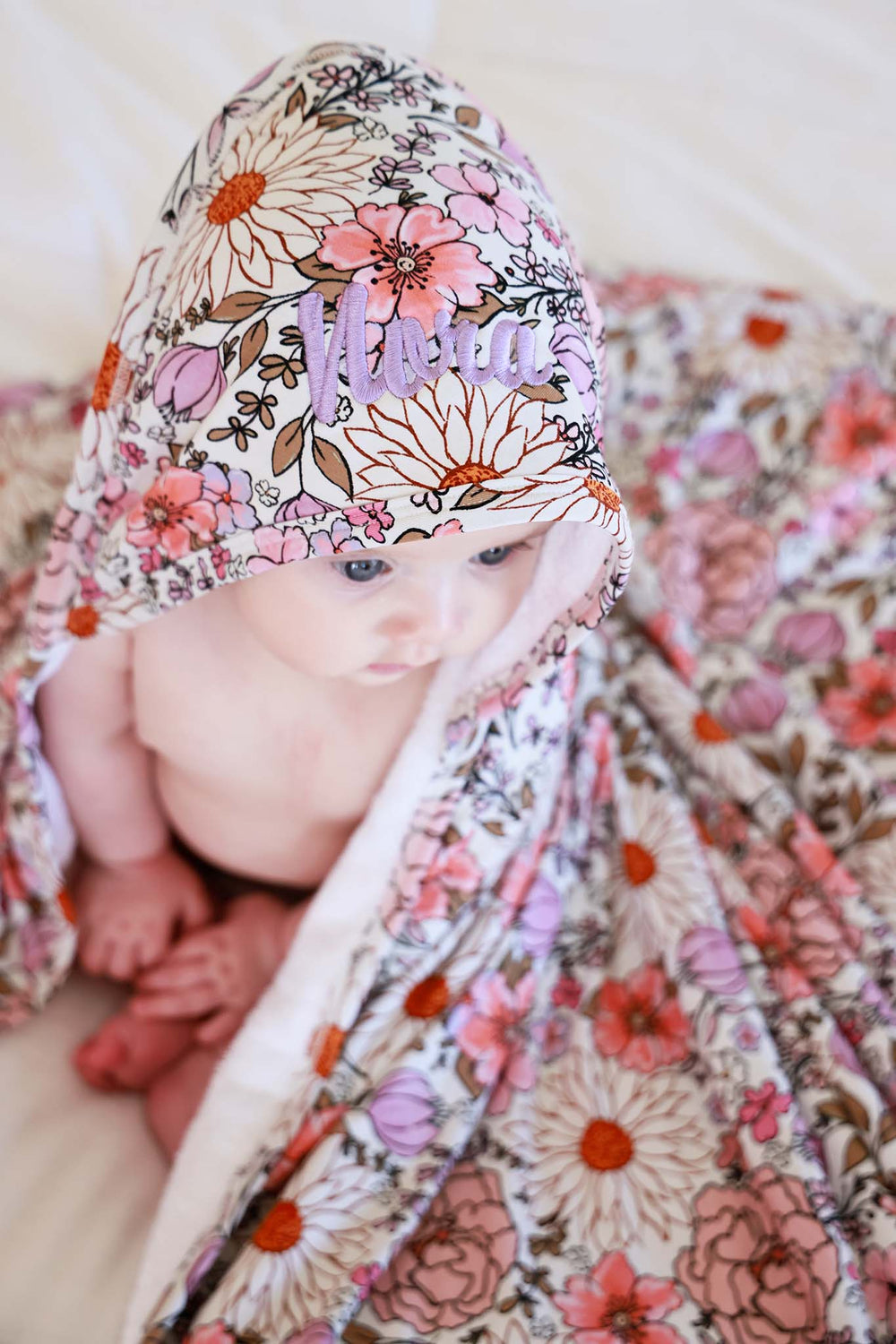 top view of embroidered purple floral towel