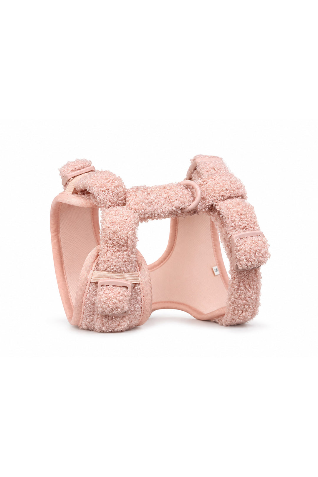 A Lane & Leash light pink plush fleece dog harness with adjustable straps and a matching pink plastic buckle, shown on a clean white background.