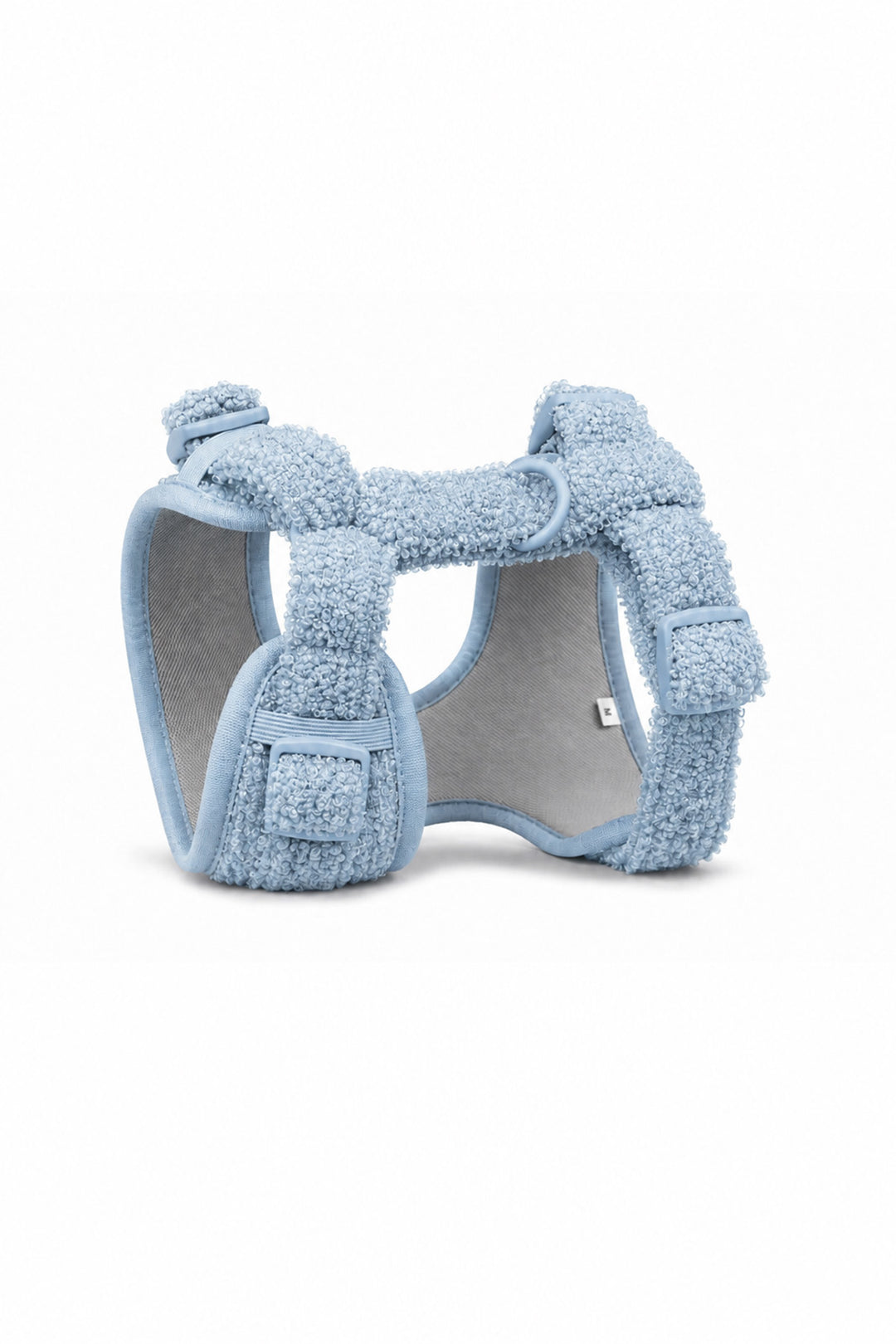 A Lane & Leash light blue fleece-lined pet harness with adjustable straps and a gray inner lining, shown on a plain white background.