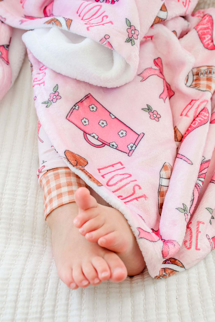 Caden Lane 'Huddles and Cuddles' pink football and cheerleading print blanket with the name Eloise