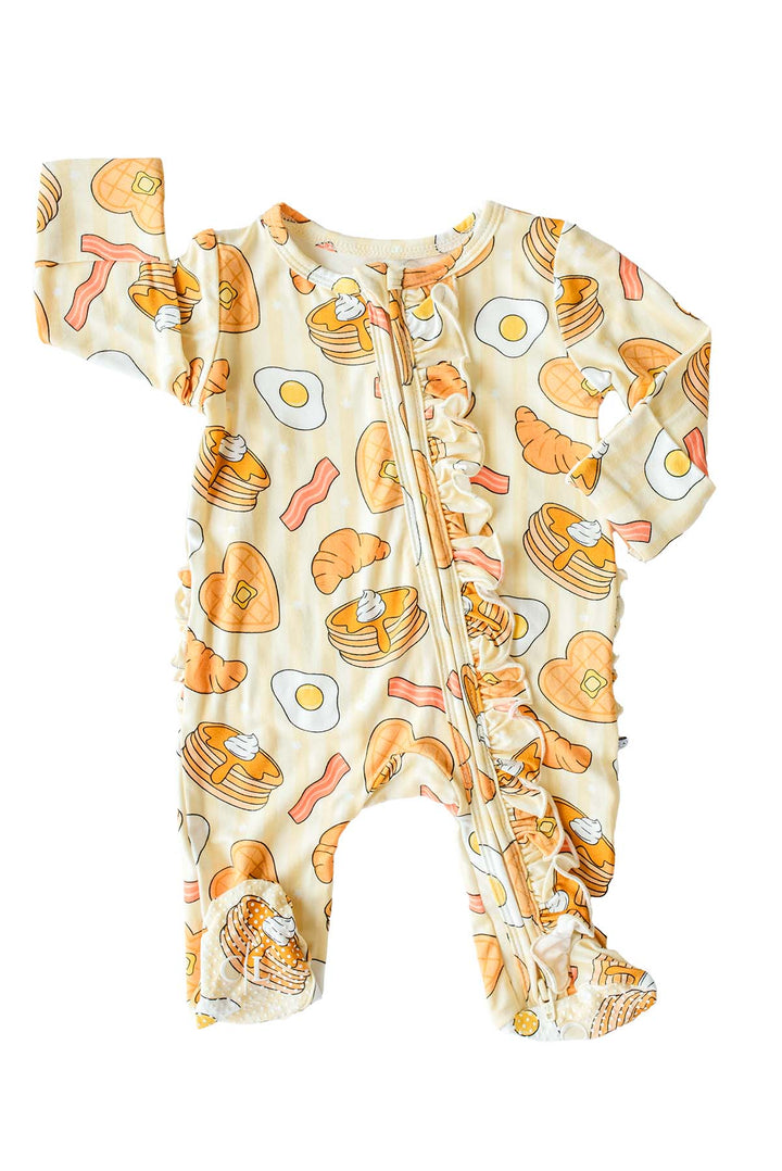 Caden Lane I Love You A Brunch ruffle zip footie, flat lay – pancakes, eggs, bacon and croissant print with ruffle trim