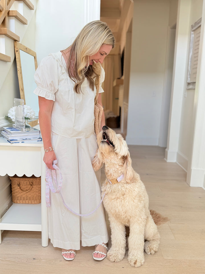 mom and dog in scattered blooms collar and leash