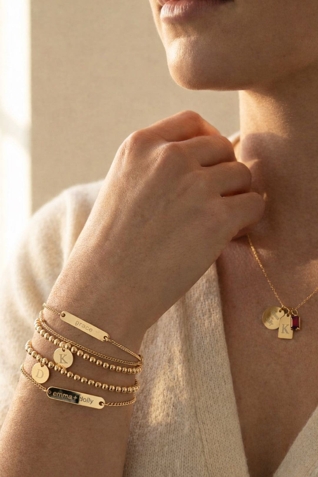 Caden Lane personalized gold jewelry set including engraved bar bracelets, initial discs, and a matching layered necklace with birthstone charm