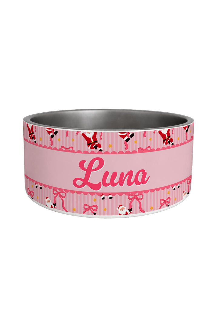 A pink Lane & Leash pet bowl with a custom name 'Luna' printed in pink script on the front. The outer band features a pink and white striped pattern with cartoon dog silhouettes and bows, while the interior is a metallic silver.