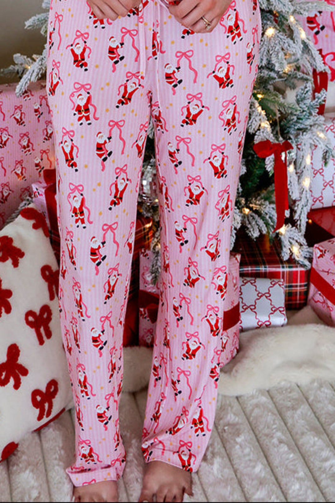 Caden Lane Women's Merry Mama Graphic Tee paired with Jolly Ribbons Christmas bamboo lounge pajama pants, featuring a festive Santa and ribbon bow print for matching family Christmas pajamas.