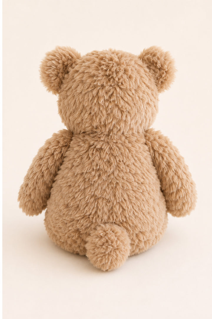 A plush teddy bear toy shown from the back, featuring soft, textured tan fur and round ears, set against a plain off-white background.