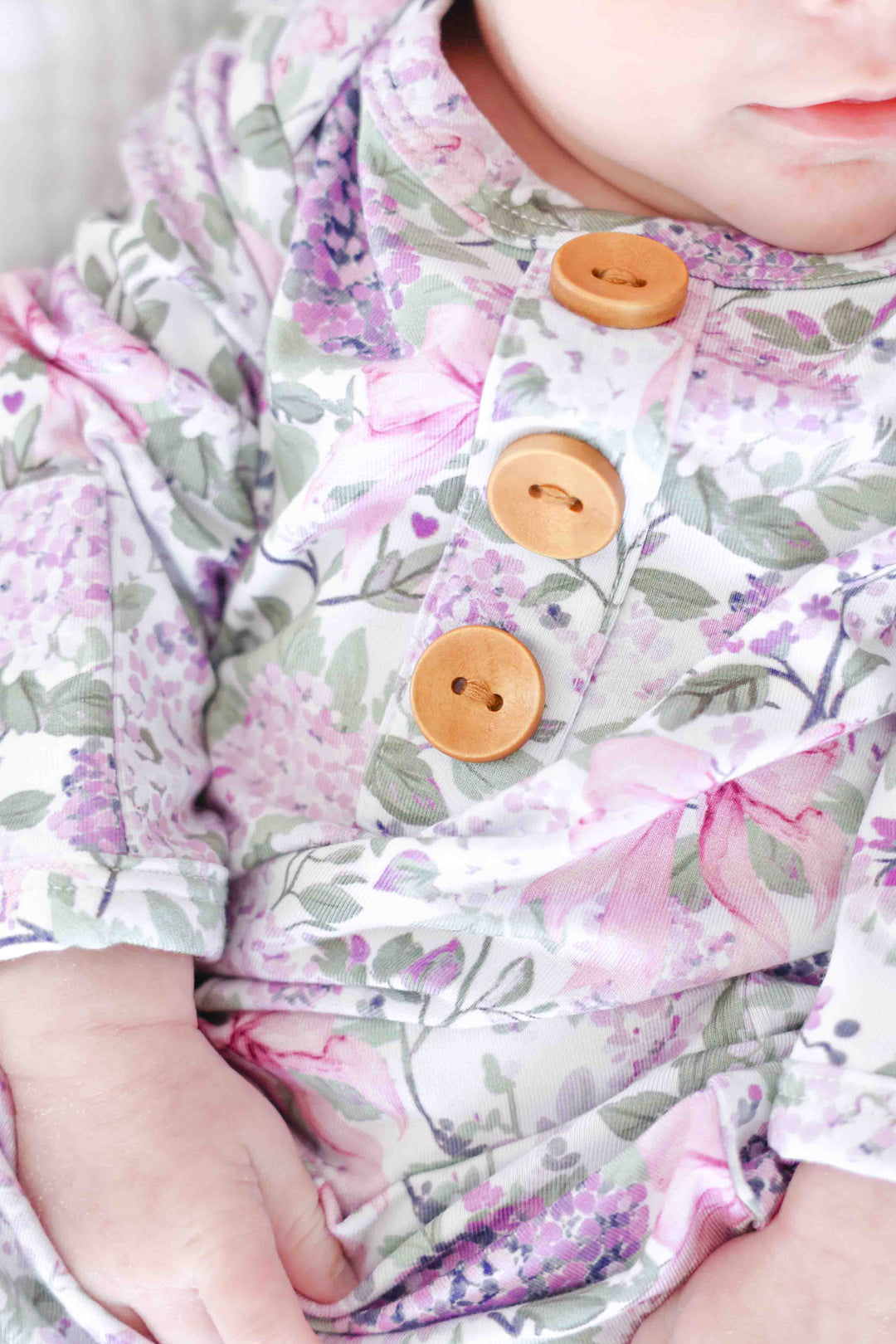 closeup of buttons on lavender lullaby newborn knot gown