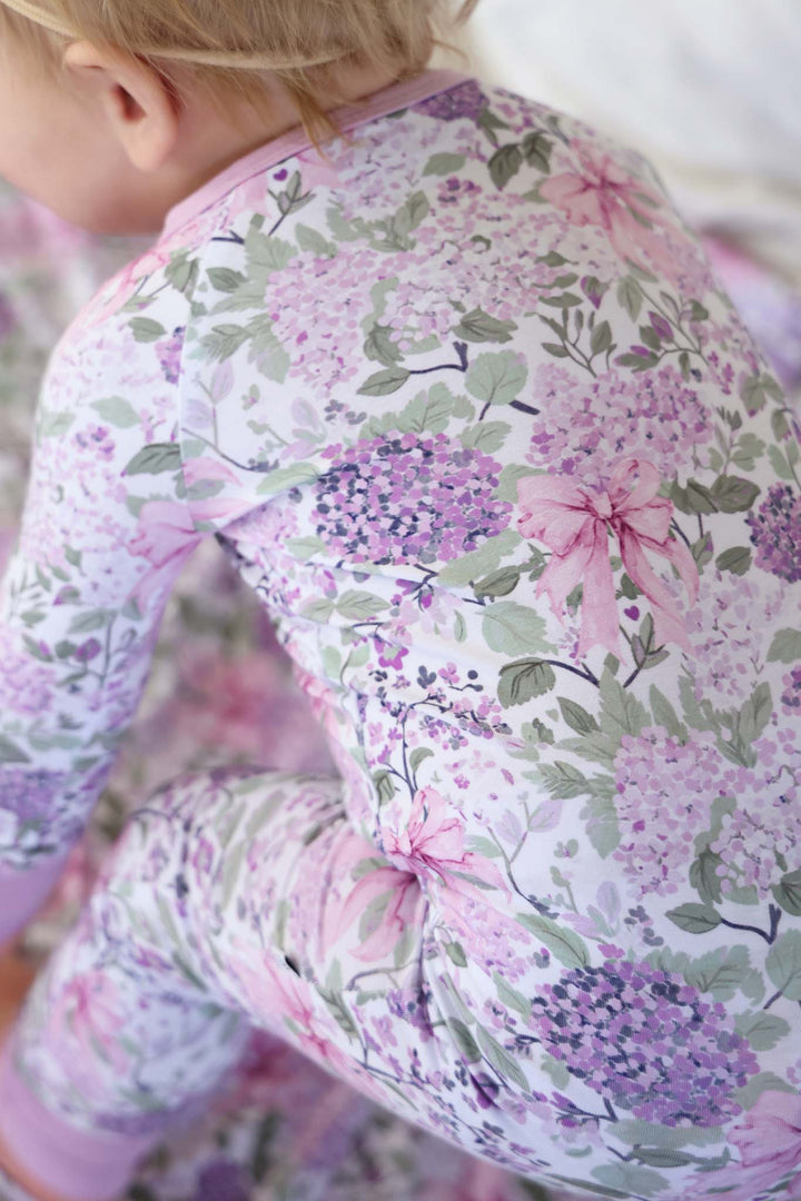 closeup of lavender lullaby print in convertible zip romper style