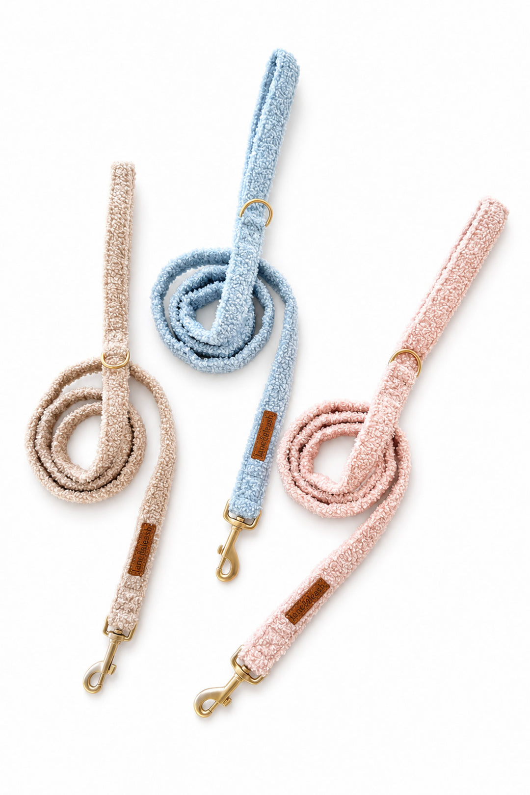 Group image of the Lane & Leash teddy leashes in the color oat (tan), stormy (blue) & petal (pink).
