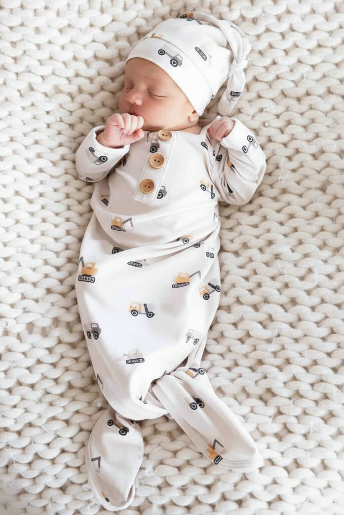 baby boy wearing the little builder newborn knot gown and hat set