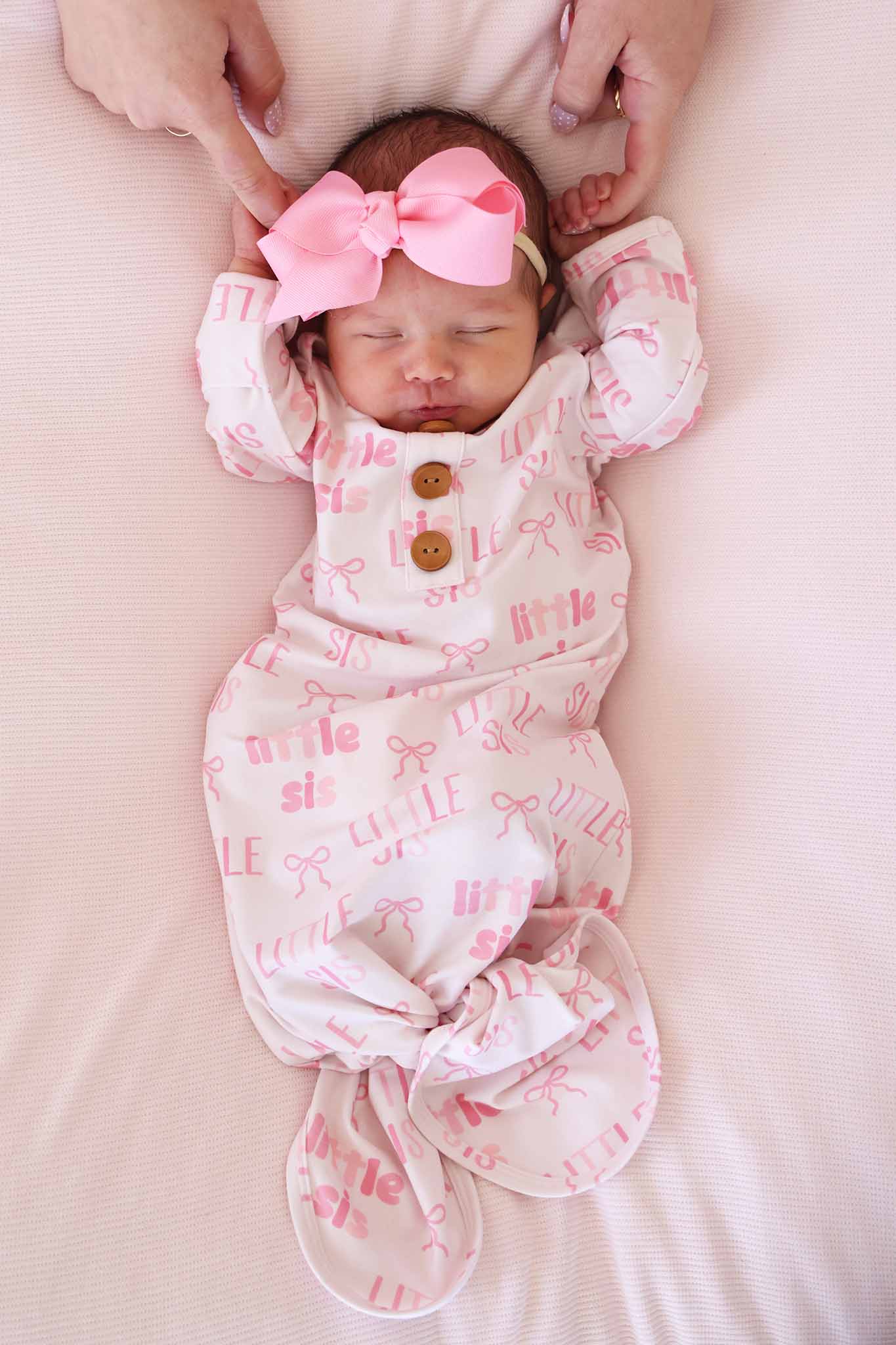 pink little sis bow newborn knot gown with matching pink ribbon bow headband 