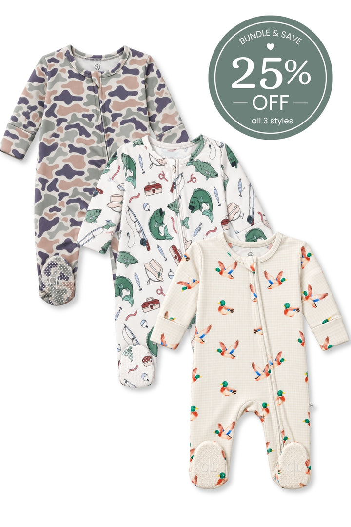 Flat lay of three Caden Lane bamboo zipper footies in Camo Cutie, Off the Hook, and Little Mallard prints featuring camouflage, bass and fishing tackle, and flying mallards.