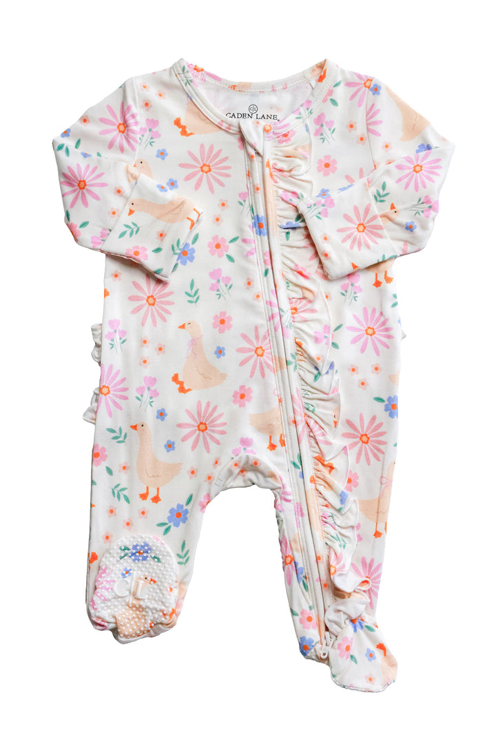 Lucy Goosy Ruffle Zipper Footie product flat lay showing the full garment with ruffle trim along the front zipper, floral duck print in cream and pink on a white background
