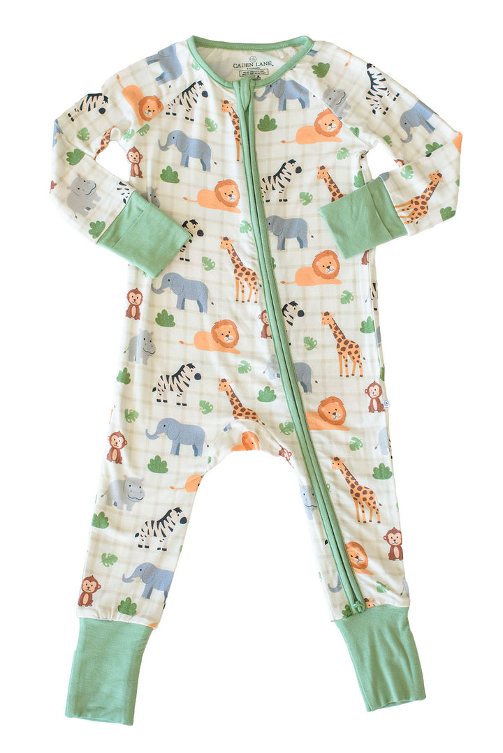Flat lay of a Caden Lane convertible zip romper in a Wild Child print featuring safari animals on cream plaid, with a sage green zipper, neckline and fold-over cuffs.