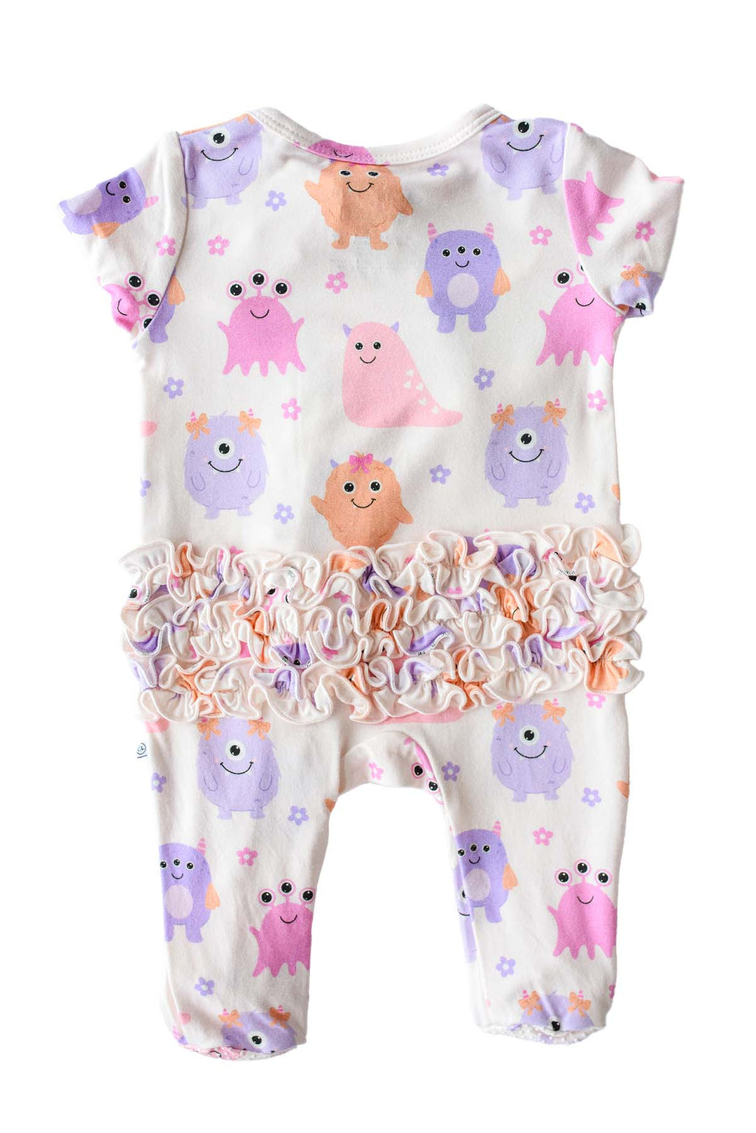 Flat lay of a Caden Lane Little Monsters ruffle zipper footie, back view showing pink, purple, and orange cartoon monsters and triple ruffle seat detail