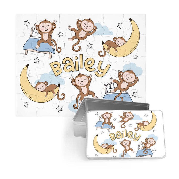 sleeping monkey jumping on the bed and sleeping on a banana moon puzzle with a matching personalized tin 