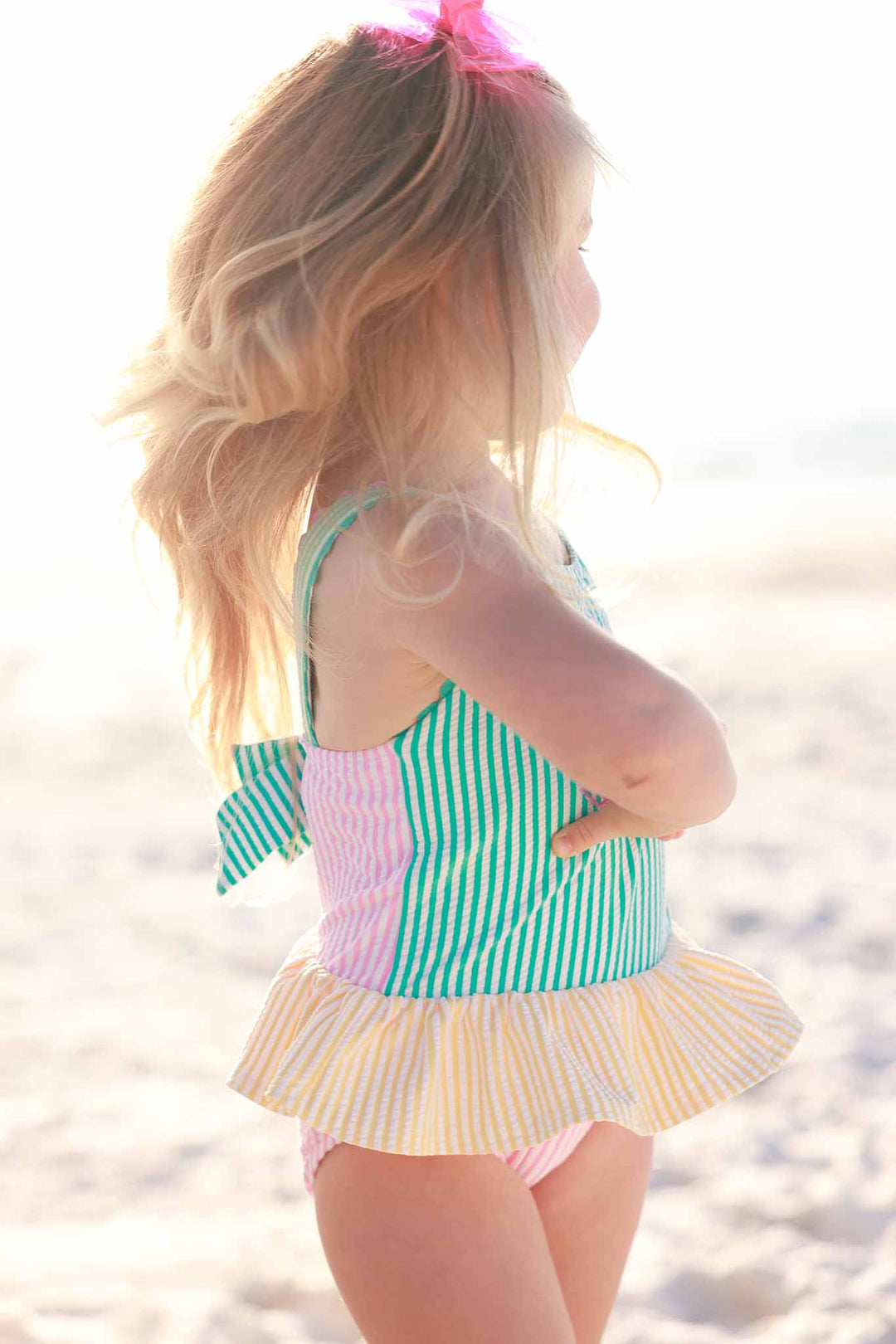 side view of seersucker one piece with skirt with color blocking 