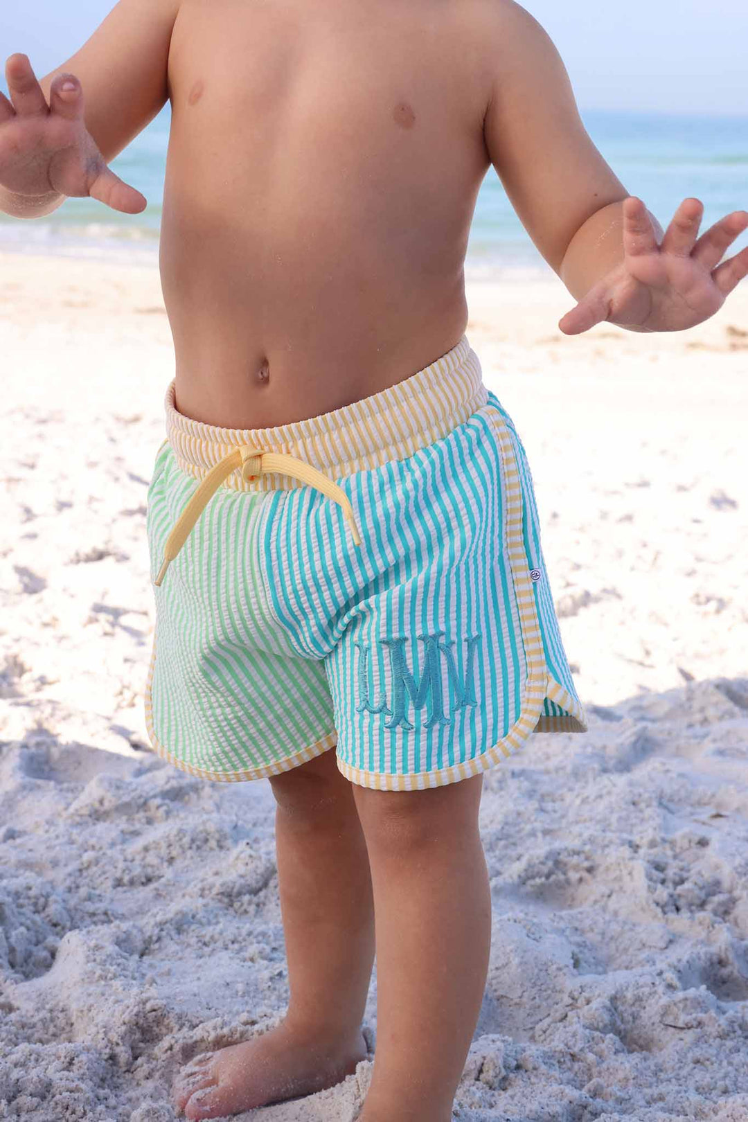 turquoise monogrammed swim trunks for boys in seersucker print 
