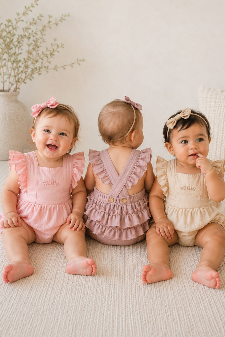 three girl in ruffle back embroidered rompers