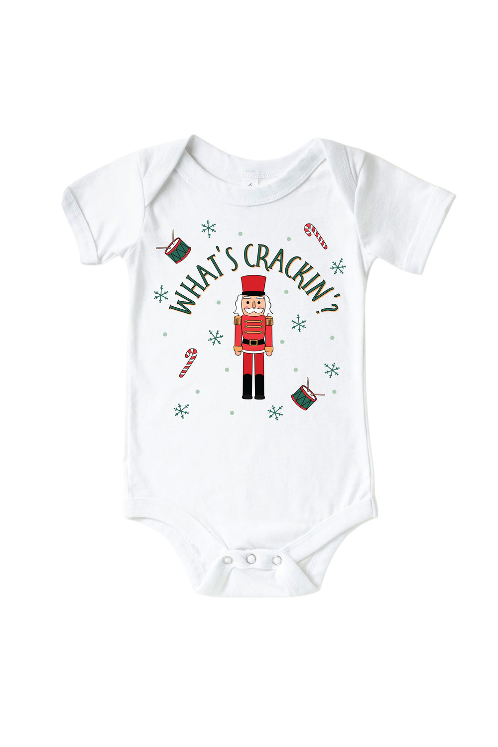 Caden Lane's white "What's Crackin'" baby onesie featuring a red and green toy soldier nutcracker with snowflakes, candy canes, and drums, laid flat.