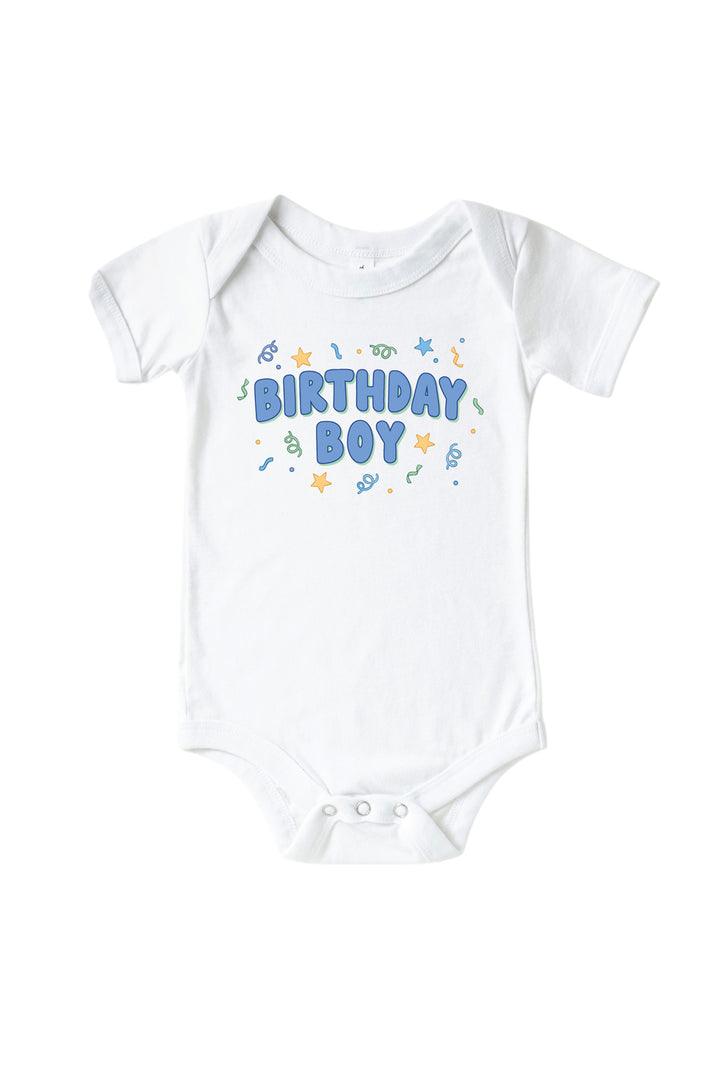 Caden Lane Birthday Bash white baby bodysuit with "Birthday Boy" printed in blue bubble letters and confetti accents.