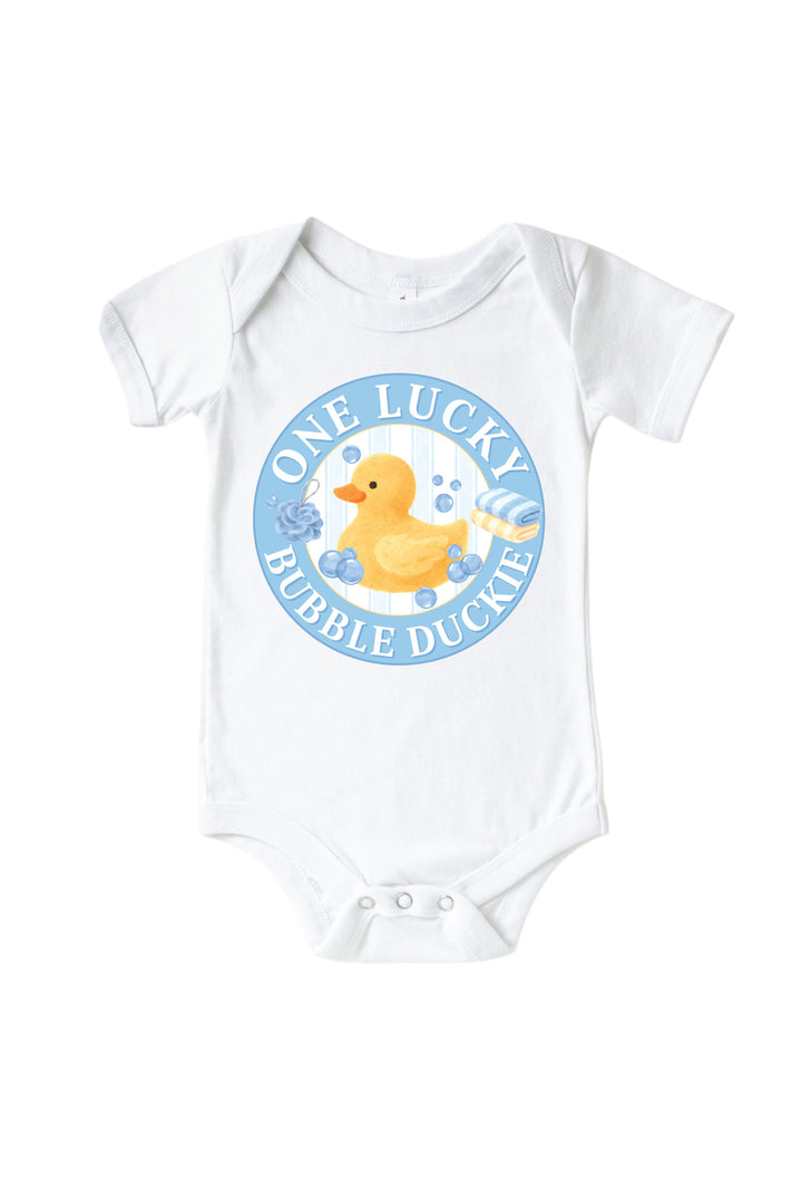 White baby bodysuit with blue circle One Lucky Bubble Duckie graphic featuring yellow rubber duck with bubbles on front