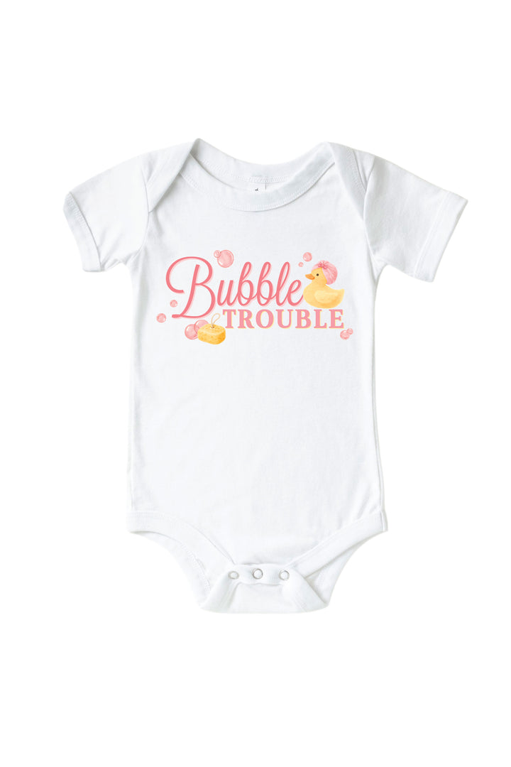 White baby bodysuit with pink Bubble Trouble cursive text graphic and yellow rubber duck with pink bubbles on front