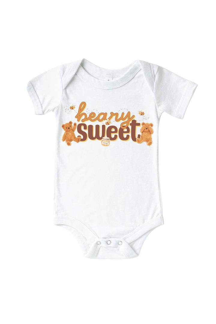 White baby onesie with 'beary sweet' text, teddy bears, bees, and a honey jar graphic, laid flat on a white background