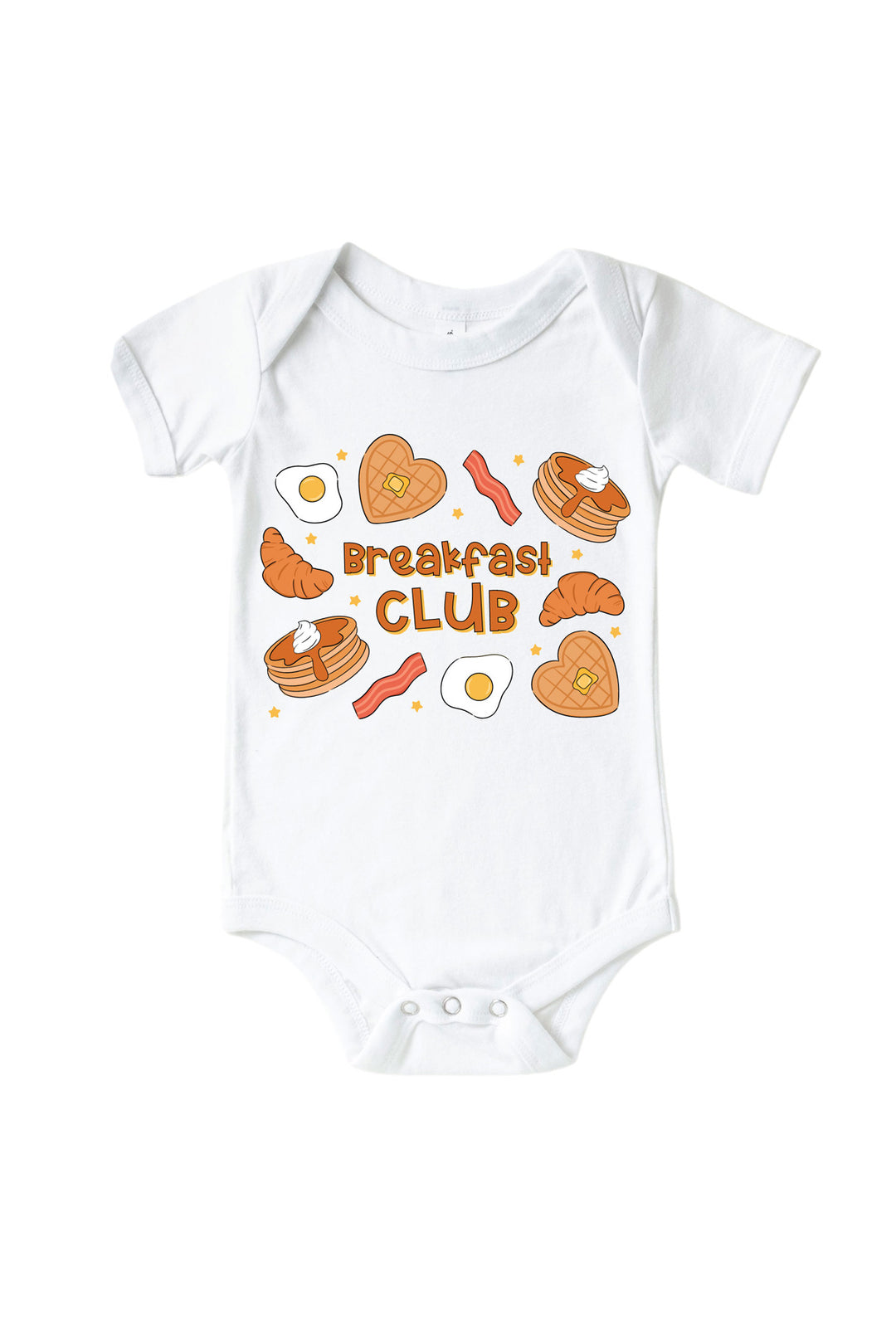 A white Caden Lane short-sleeve baby bodysuit featuring a colorful graphic print of breakfast items like pancakes, croissants, bacon, and eggs, with the text 'breakfast CLUB' in the center, displayed on a clean white background.