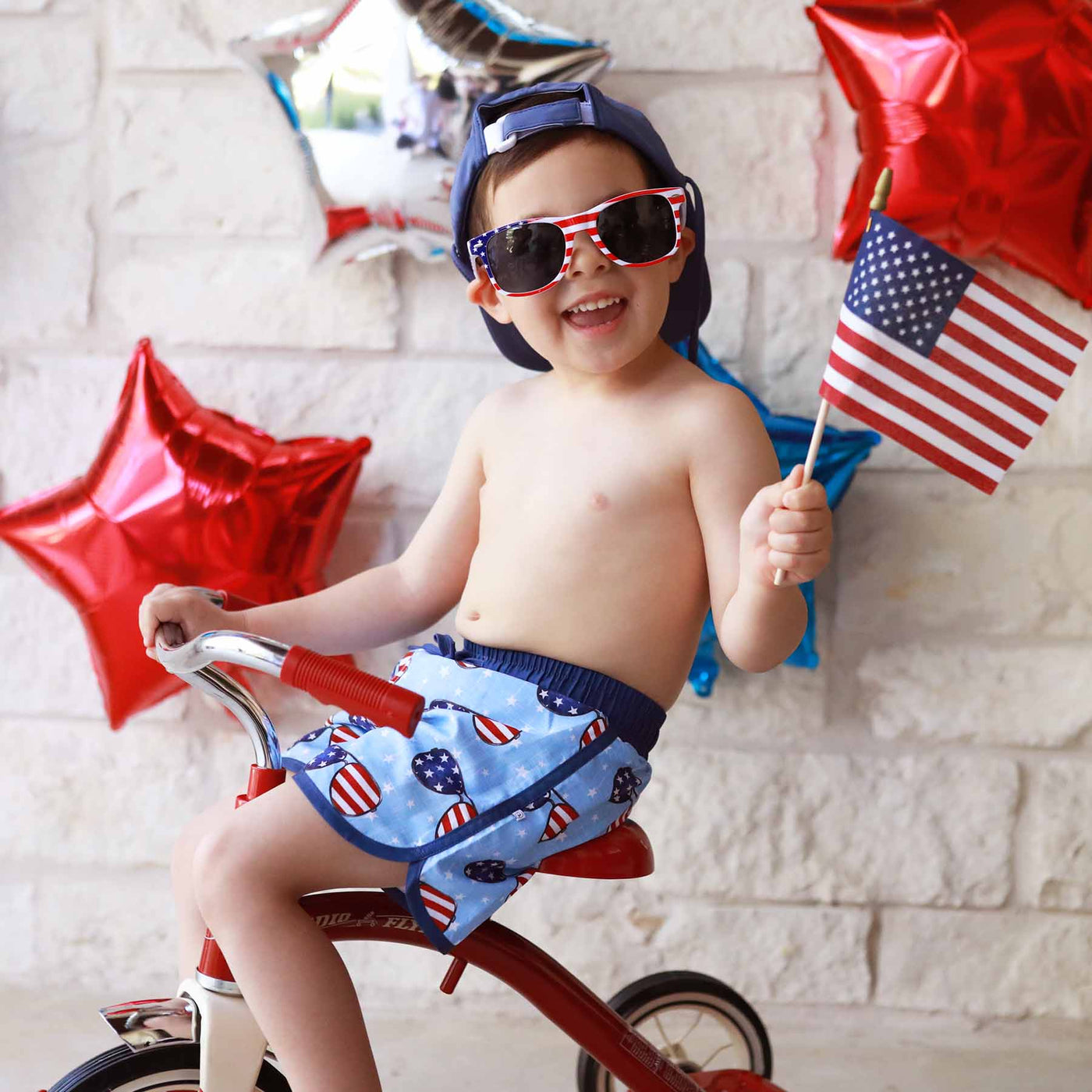 above the knee swim trunks for boys red, white and blue sunglasses for the 4th of july 