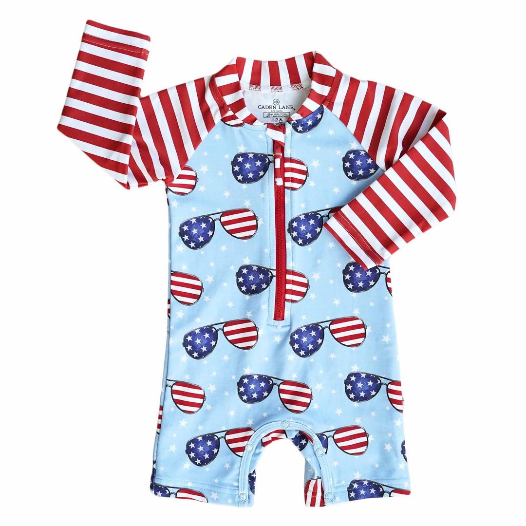 long sleeve rash guard swim romper shortie for babies with patriotic sunglasses 
