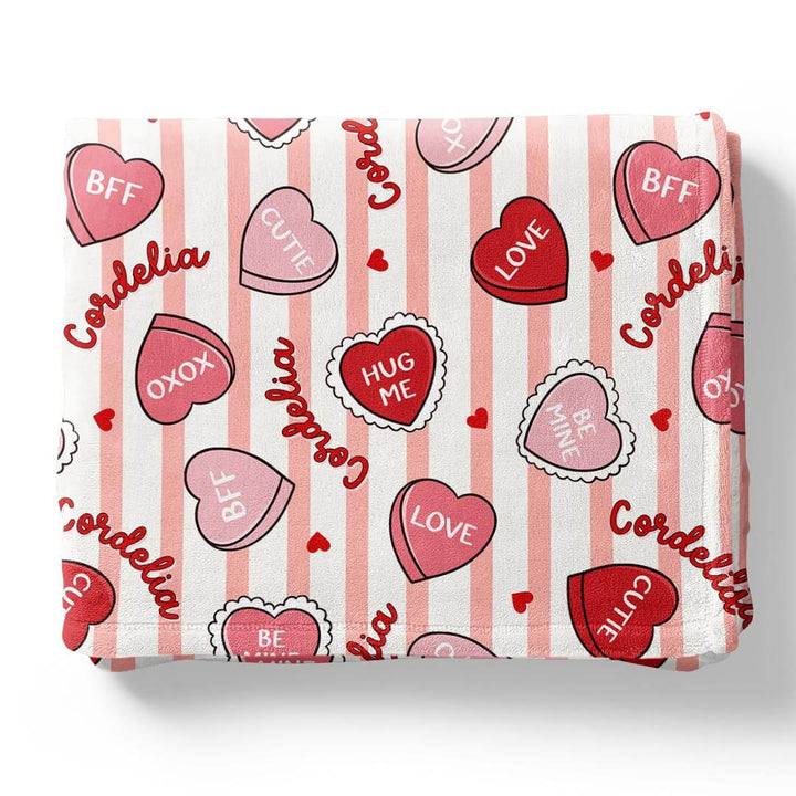 Minky flat lay of sweet like candy personalized kids blanket in pink 