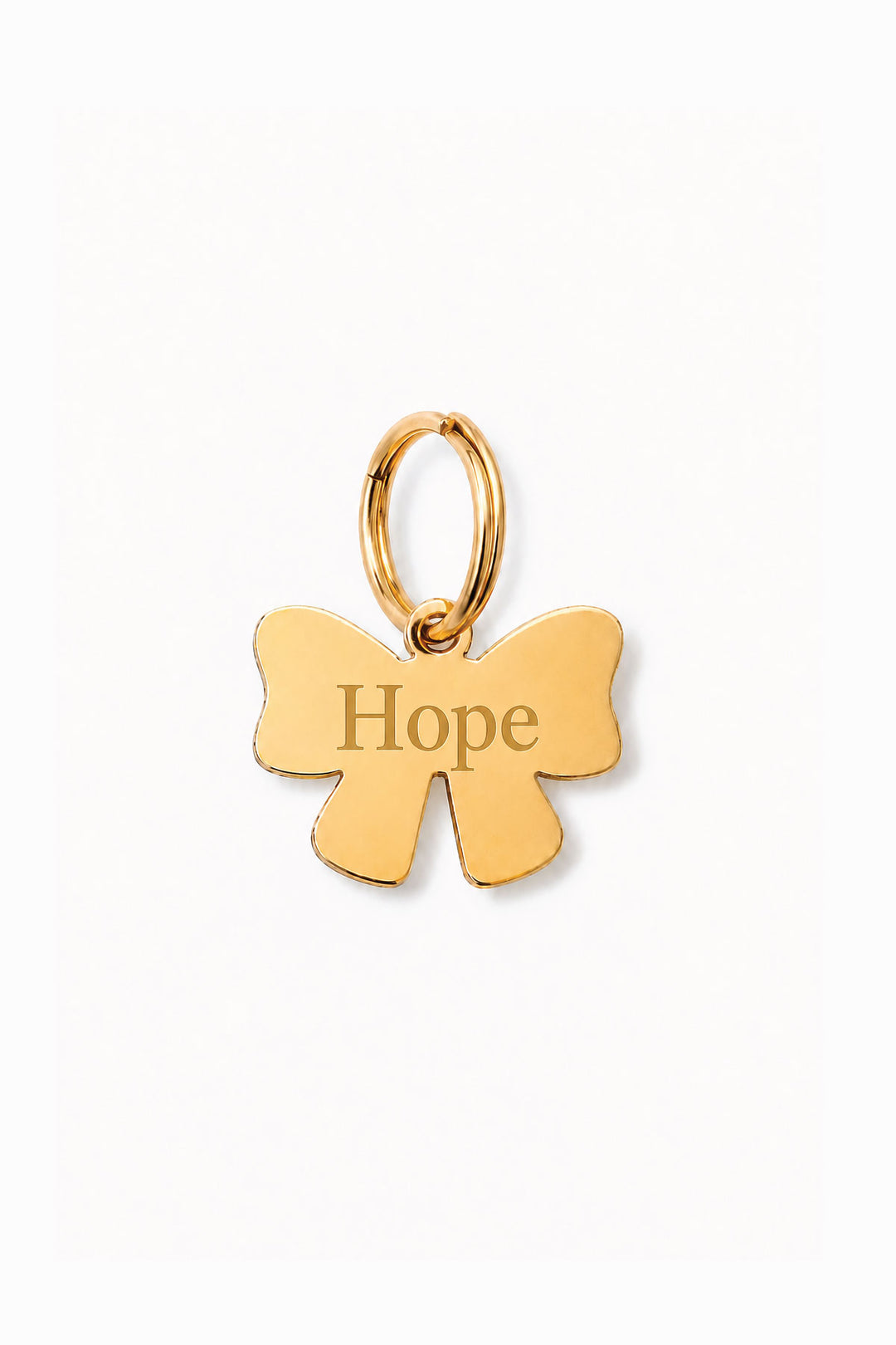 Gold bow-shaped engraved pet ID tag with sample name "Hope" and gold O-ring, on white background