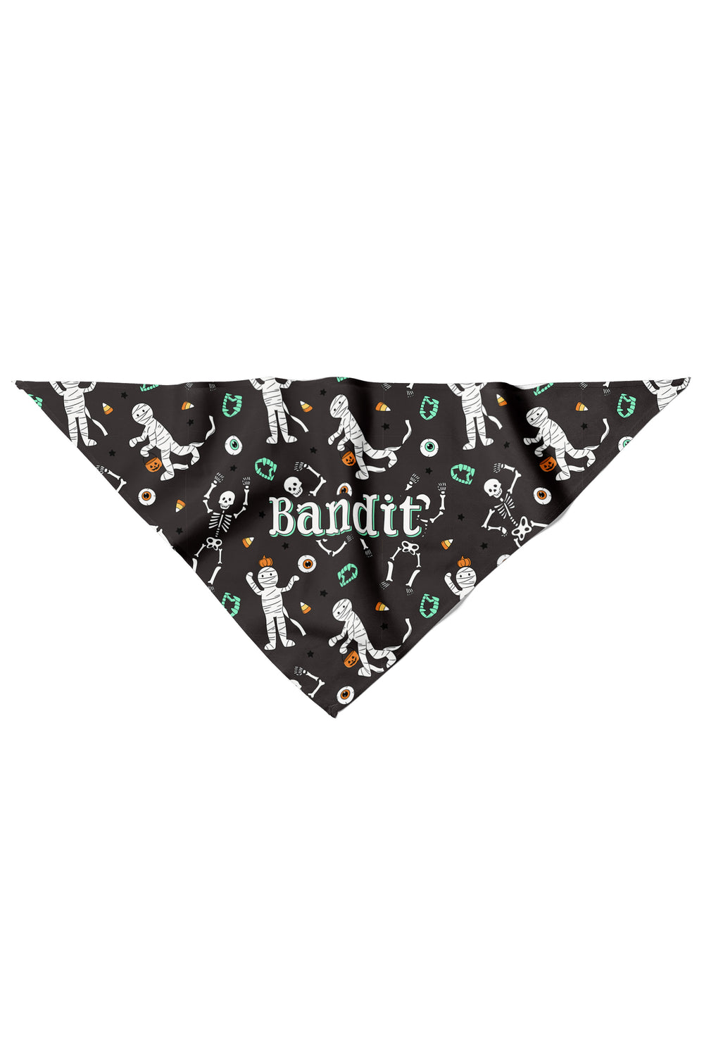 Flat lay of a black dog bandana personalized with the name 'Bandit' and Halloween mummy and skeleton graphics.
