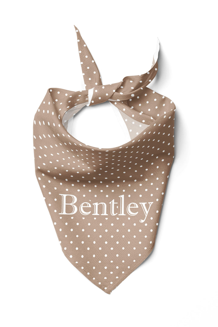 Personalized latte brown polka dot pet bandana tied at the neck, showing the name 'Bentley' embroidered in white