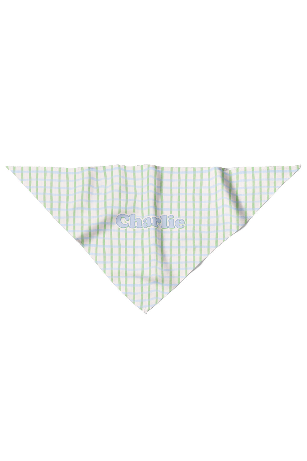 Flat lay of a personalized pet bandana in green and blue picnic plaid, shown as a triangle with the name "Charlie" personalized on the front